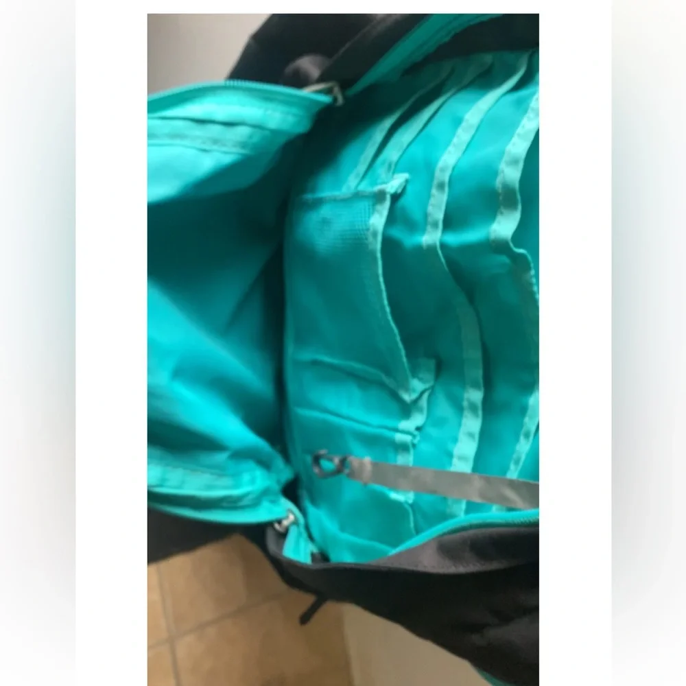 The North Face Jester Black Backpack with Teal Straps